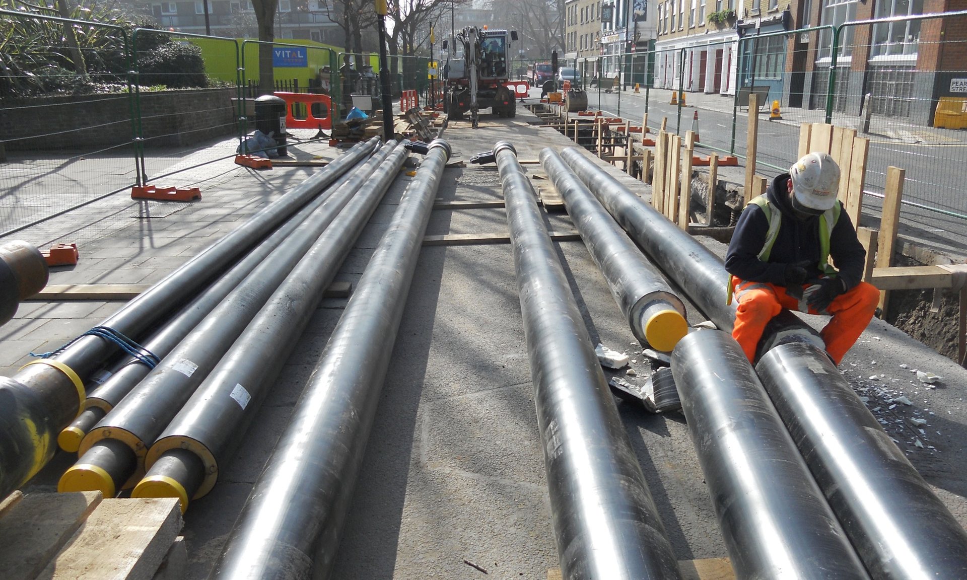 A workman installing heat network pipes in Islington, London. 